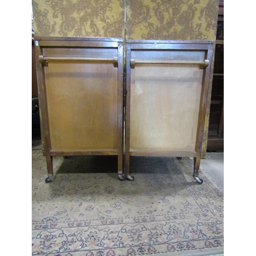 2383A - A pair of vintage oak side cabinets (possibly ex medical)raised on casters 48cm w x 43cm d x 87cm h