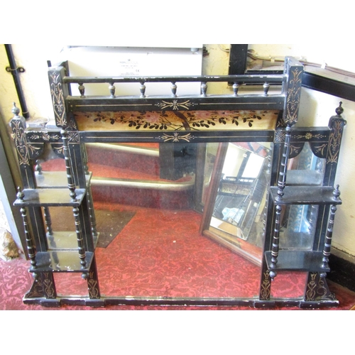 2404 - An Edwardian overmantle mirror with seven mirror plates, the ebonised frame with gilt detail, the ce... 