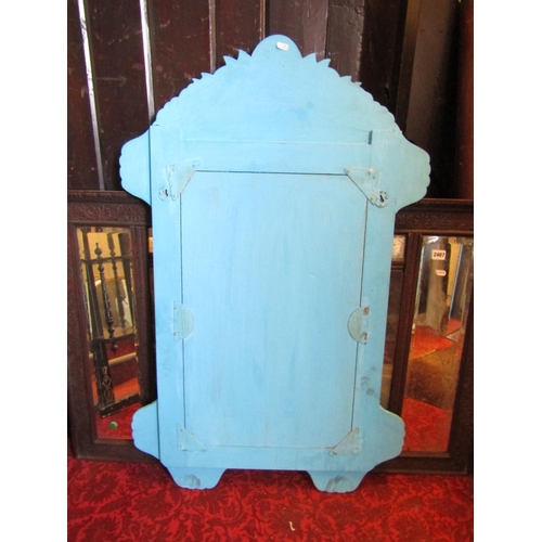 2405 - An Indian wall mirror the turquoise background inlaid with mother of pearl panels set within a shape... 