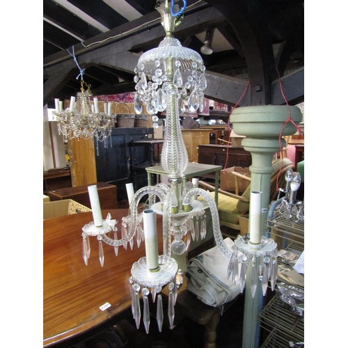 2437 - A good quality five branch cut glass chandelier with facet cut column and branches with prism and fe... 