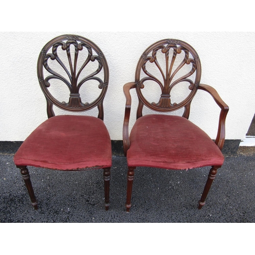 2450 - A set of ten (8+2) George III style dining chairs, with carved backs and stuff over seats, raised on... 