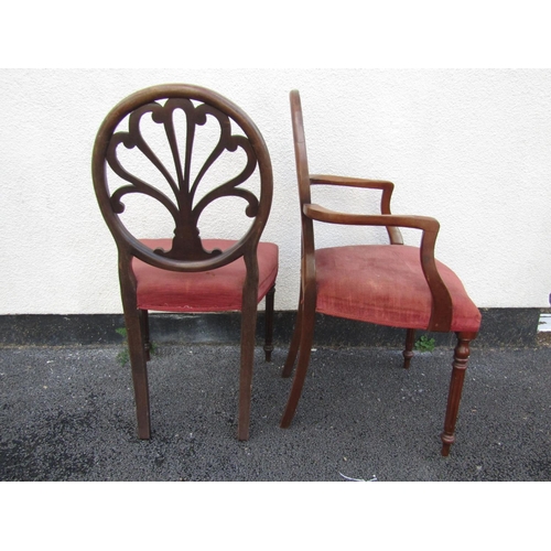 2450 - A set of ten (8+2) George III style dining chairs, with carved backs and stuff over seats, raised on... 