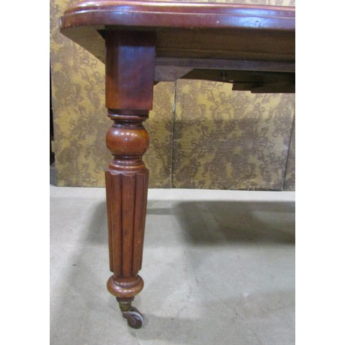 2277 - A Victorian mahogany extending dining table - cottage sized, raised on four turned and fluted suppor... 