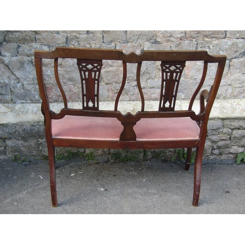 2365 - An Edwardian mahogany parlour room sofa, the frame with carved and pierced inlaid detail, 110cm wide