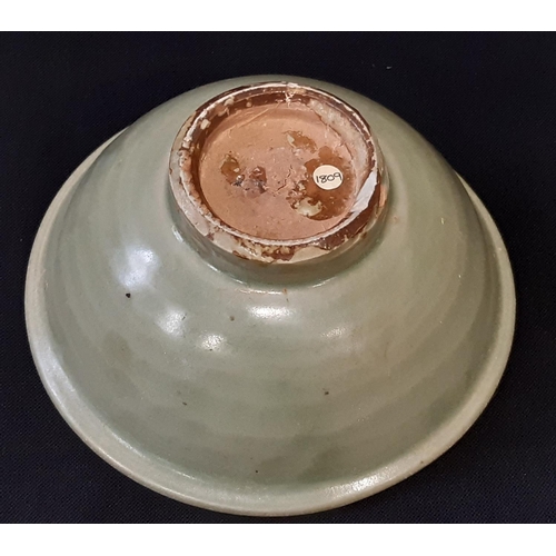 1072A - Small 19th century or earlier Chinese Celadon glazed footed bowl with internal incised motif. Height... 