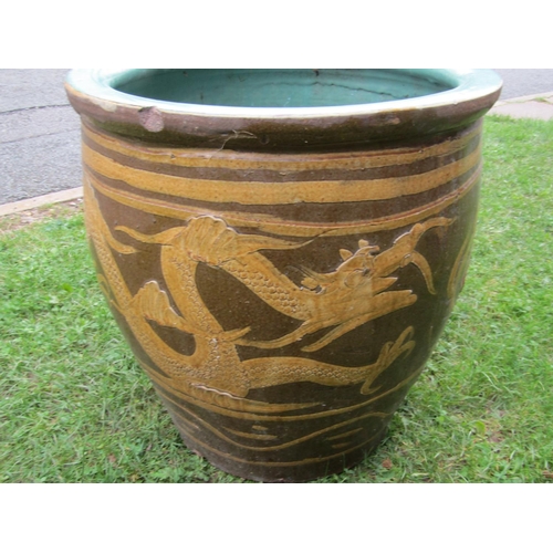 2087 - A glazed Chinese planter/jardinière with dragon detail, approx 50cm diameter x approx same high, the... 