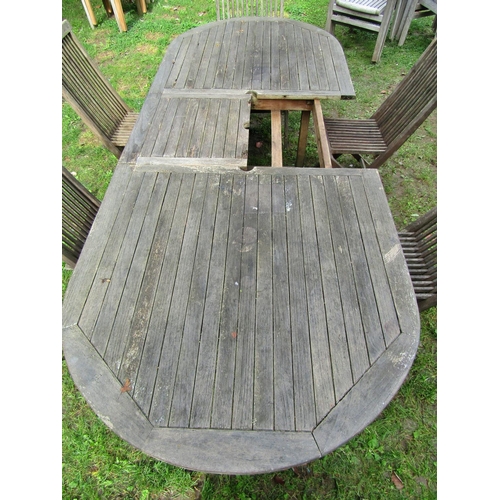 2051 - A weathered Marlborough teak D end extending garden table with single additional leaf (af incomplete... 