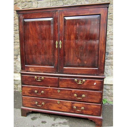 2146 - A George III mahogany two sectional dwarf linen press, the upper section enclosed by a pair of recta... 