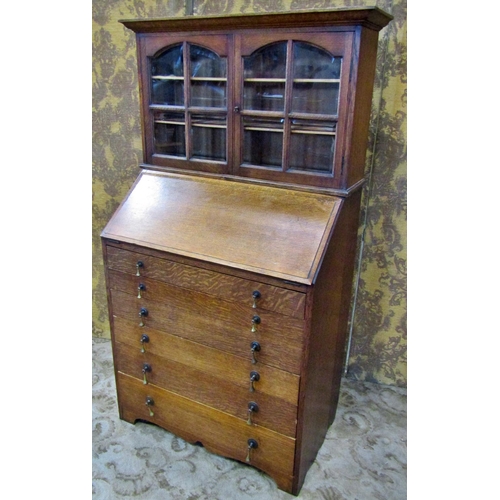 2274 - An unusual oak bureau bookcase of diminutive proportions, 139cm high, 79 x 42cm (maximum)