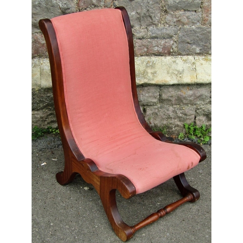 A Victorian mahogany drawing room chair with scrolled outline on turned supports and a Georgian mahogany elbow chair