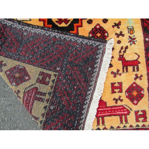 1814 - A north east Persian Meshed Belouch rug, with two central medallions on a natural wool field of anim... 