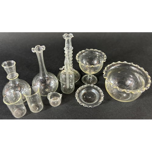 1114 - A set of miniature hand blown glass doll’s house glass ware, including carafes, a bowl, beakers, can... 