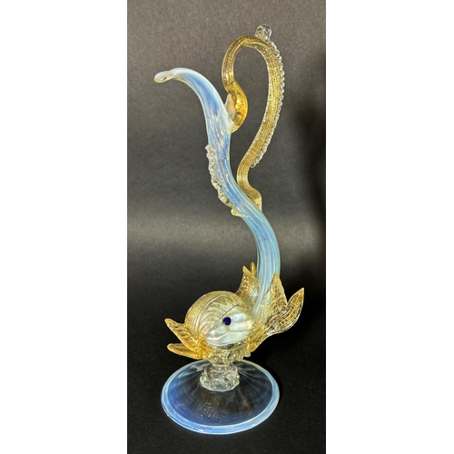 1131 - A Murano glass wine carafe in the form of a galleon, a Murano glass dolphin, two Murano glass jugs w... 