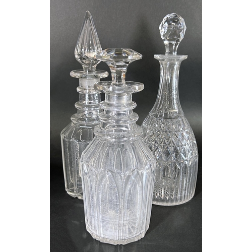 1132 - Three late 19th and early 20th century cut glass decanters, a vase and a glass water jug.