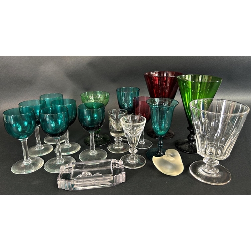 1134 - A blown green glass carafe with ice tank, a flat bottomed carafe, a tall slender cranberry decanter ... 