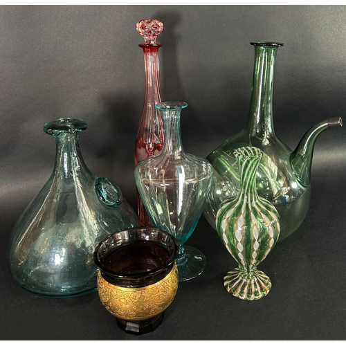 1134 - A blown green glass carafe with ice tank, a flat bottomed carafe, a tall slender cranberry decanter ... 