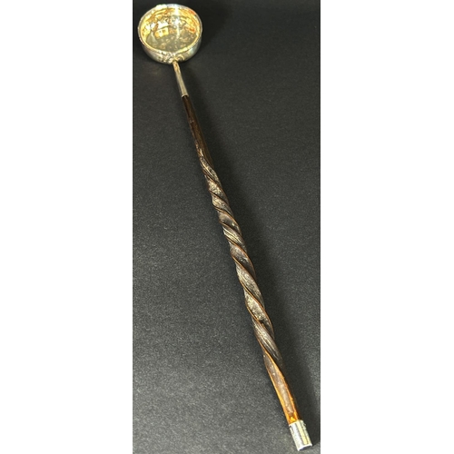 1171 - A silver metal toddy ladle with twisted cow horn handle, 42 cm long