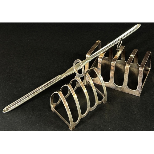 1172 - Two silver toast racks both English hallmarked and a silver plated marrow scoop, 3.8 oz approx  (3)