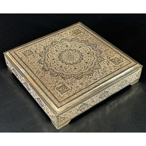 1176 - A richly engraved and incised Iranian silver box with a dedication to the inside of the lid, stamped... 