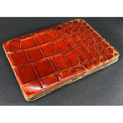 1178 - A late Victorian gentleman's crocodile wallet with 925 silver corners, makers Birmingham plate & cut... 