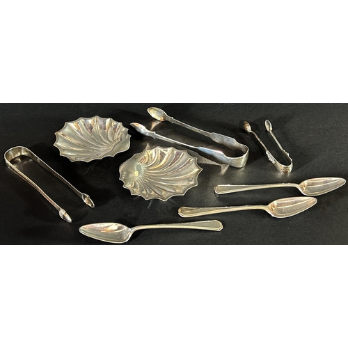 1182 - A pair of silver scallop shell butter dishes, Sheffield 1917, makers Atkin Brothers, together with t... 