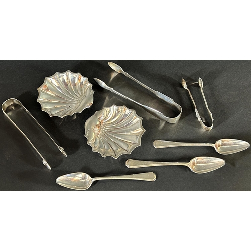 1182 - A pair of silver scallop shell butter dishes, Sheffield 1917, makers Atkin Brothers, together with t... 