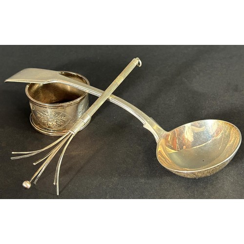 1183 - A Victorian silver sauce spoon, London 1860, makers The Portland Company, a silver napkin ring and a... 