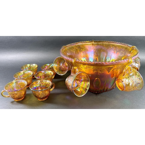 1127 - An amber carnival glass punch bowl with eleven glasses, four colourful St Louis champagne flutes, a ... 