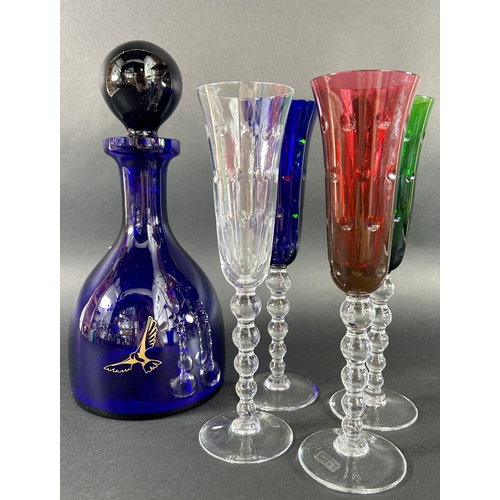 1127 - An amber carnival glass punch bowl with eleven glasses, four colourful St Louis champagne flutes, a ... 