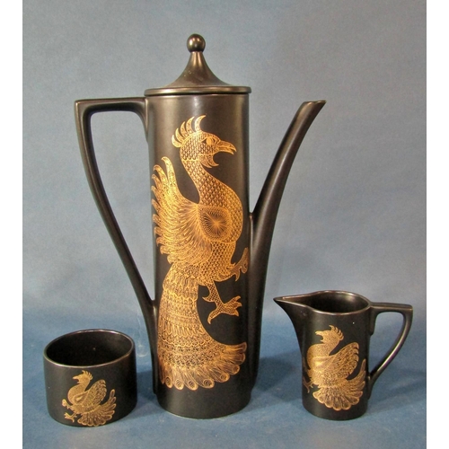 1017 - A Portmeirion 'Phoenix' coffee pot, cream and sugar jug and six coffee cans, together with Paragon f... 