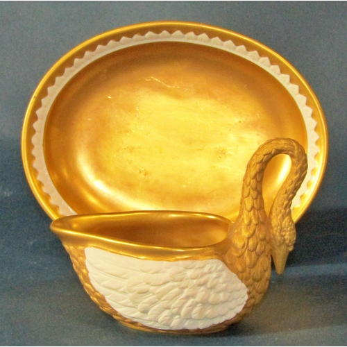 1023 - A Dresden gilt bisque porcelain swan cup and saucer (cup 8cm high, saucer 15 x 12cm) together with a... 