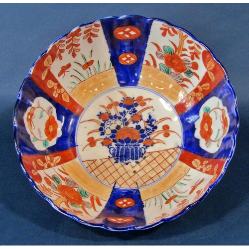 1050 - A Japanese export Imari palette bowl, 12 cm high, 25 cm diameter together with two further Imari pal... 