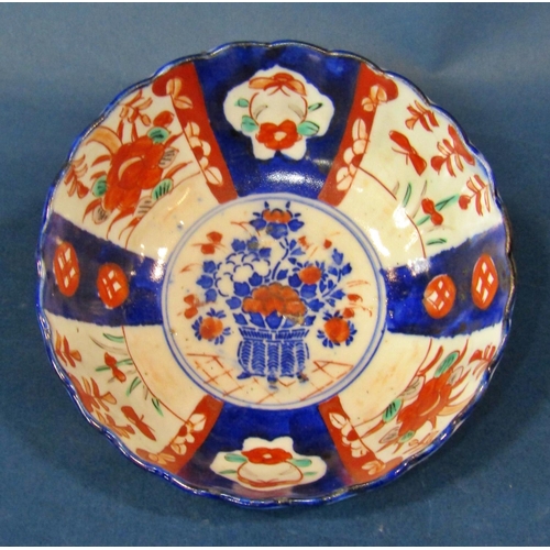 1050 - A Japanese export Imari palette bowl, 12 cm high, 25 cm diameter together with two further Imari pal... 