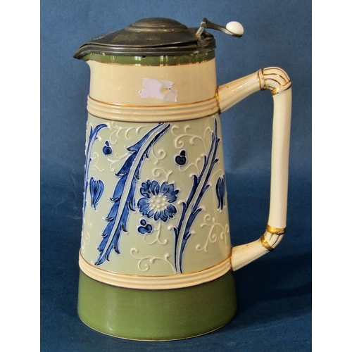 1058 - A James Macintyre & Co Faience tankard of tapering form with applied pewter thumb-paw cover, mark to... 