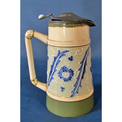 1058 - A James Macintyre & Co Faience tankard of tapering form with applied pewter thumb-paw cover, mark to... 