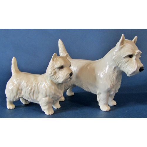 1061 - A group of models of West Highland terriers to include a small Royal Worcester example of a seated W... 