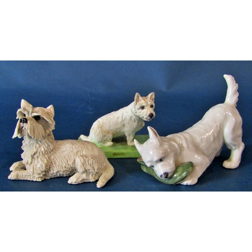 1061 - A group of models of West Highland terriers to include a small Royal Worcester example of a seated W... 