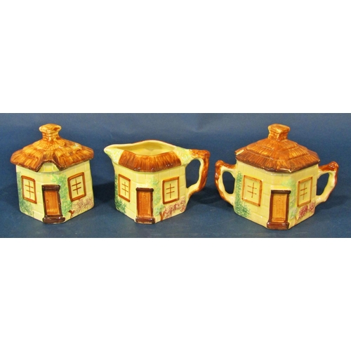 1073 - A group of cottageware porcelain items to include teapots, butter dishes, etc, also together with a ... 