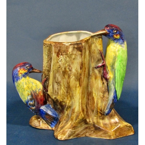 1083 - Three Radford pottery vases decorated with five woodpeckers together with a further model bird, a wa... 