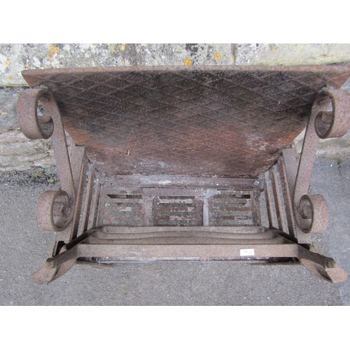 2113 - An old iron fire basket with scrolling mounts, 66cm high, 49cm wide.