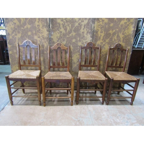 2208 - A set of four 19th century French provincial mixed wood dining chairs with rush seats, open slatted ... 