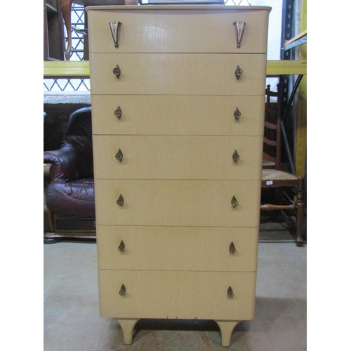 2214 - A mid 20th century upright chest of drawers, 129cm high, 64 x 48cm