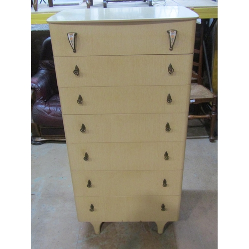 2214 - A mid 20th century upright chest of drawers, 129cm high, 64 x 48cm