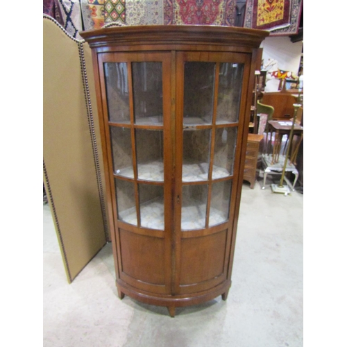 2215 - A late 19th century continental cherry wood bow fronted corner cupboard, 80cm high.