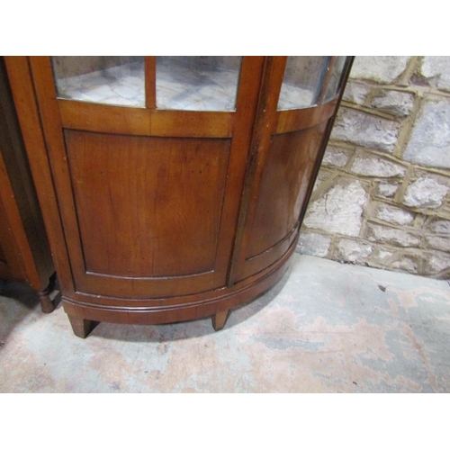 2215 - A late 19th century continental cherry wood bow fronted corner cupboard, 80cm high.