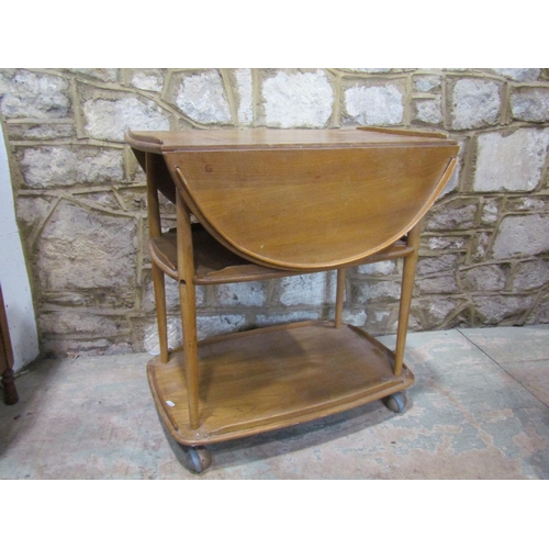 2220 - A pale Ercol tea trolley, 75cm high.