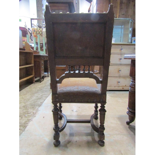 2221 - An Edwardian oak dining table, with canted corners raised on broad fluted supports and casters, 73 c... 