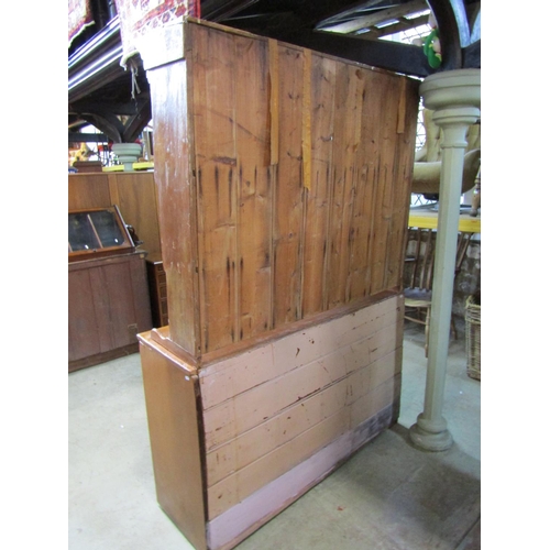 2226 - A grained pine dresser, fitted with two drawers and two pairs of panelled cupboard doors enclosing a... 