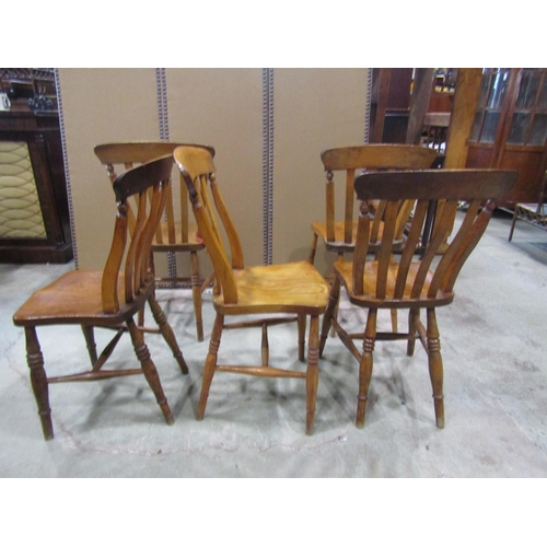 2236 - Five Windsor kitchen chairs, with elm seats, raised on turned legs and stretchers (5)