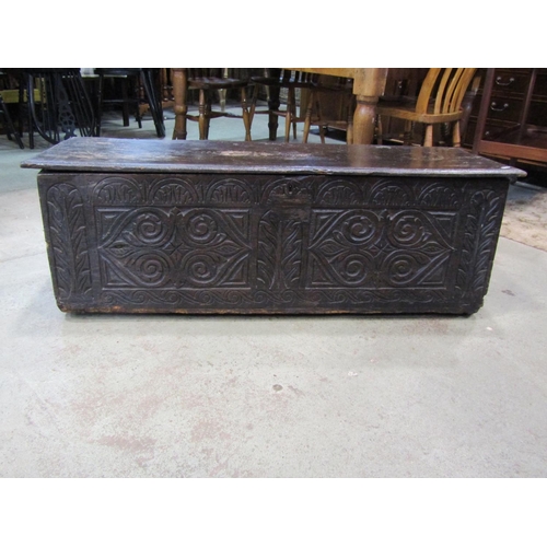 2237 - An 18th century and later over-carved elm coffer, 44cm high, 108 x 46cm.